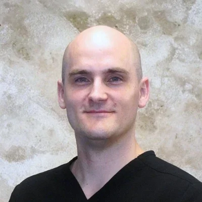 A headshot photo of Dr. Travis Pederson
